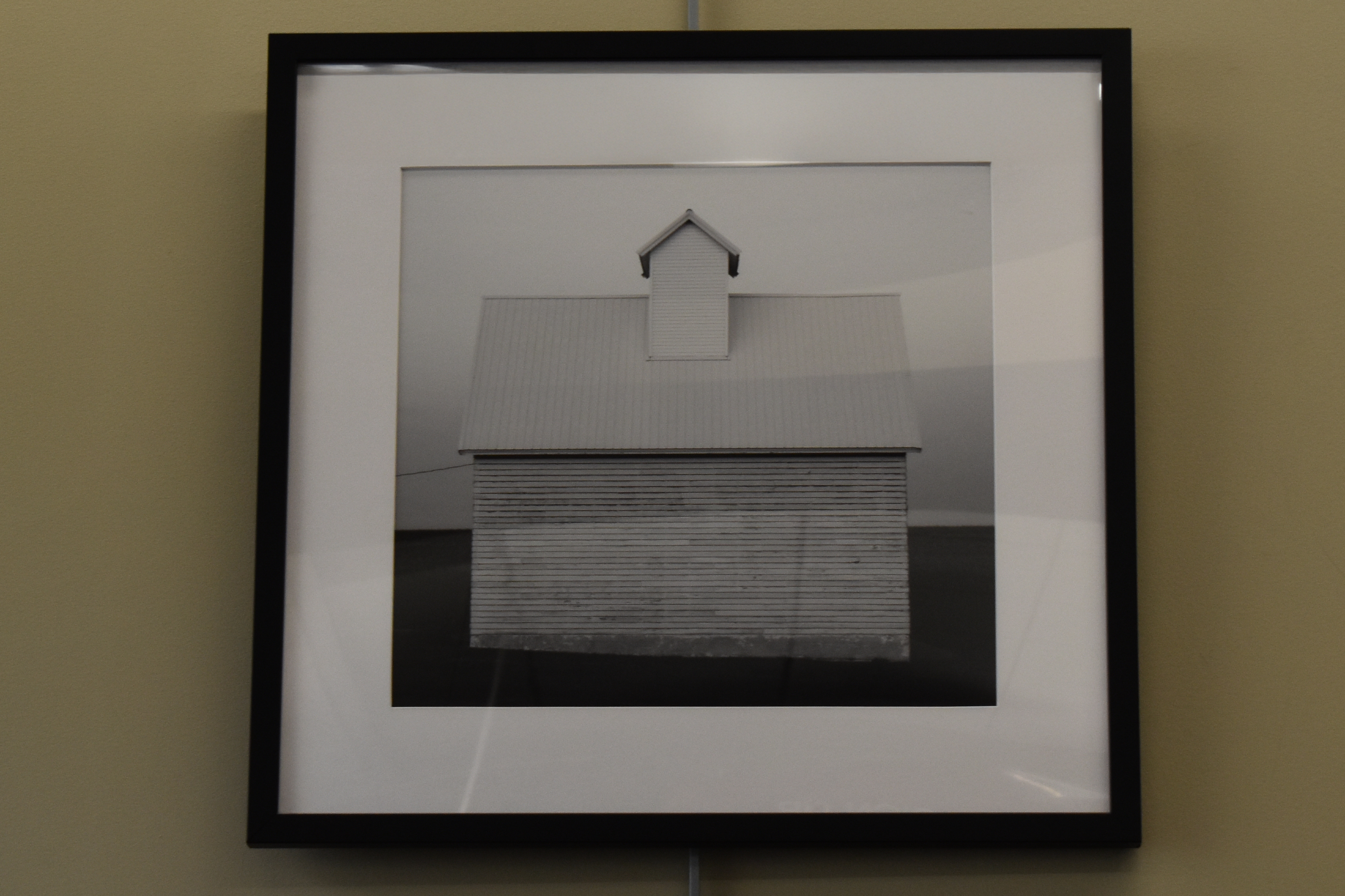 black and white photo of a barn