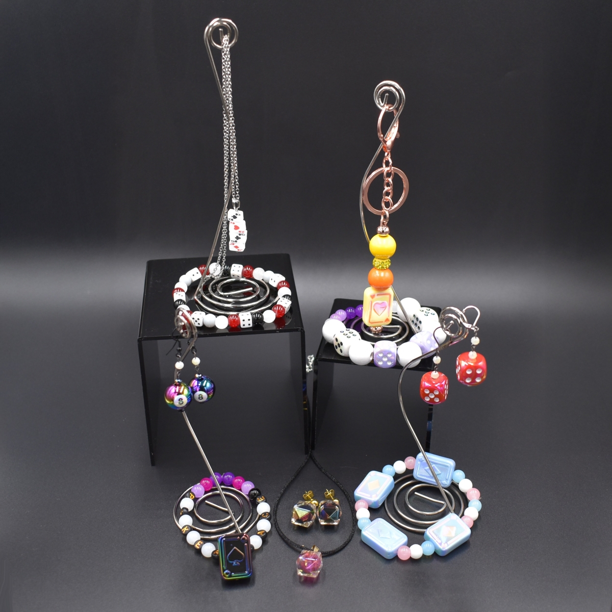 Necklaces, bracelets, and earrings made with gaming-themed beads.