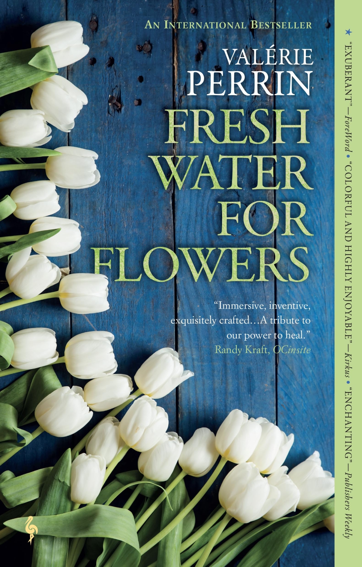 book cover with white tulips on a blue wood background
